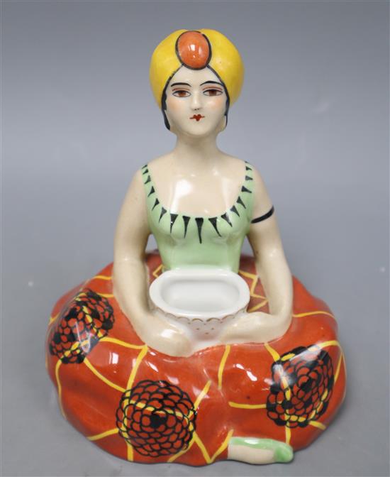 Henri Delcourt, Boulogne-Sur-Mer. A porcelain inkwell modelled as a figure of a genie, height 16cm